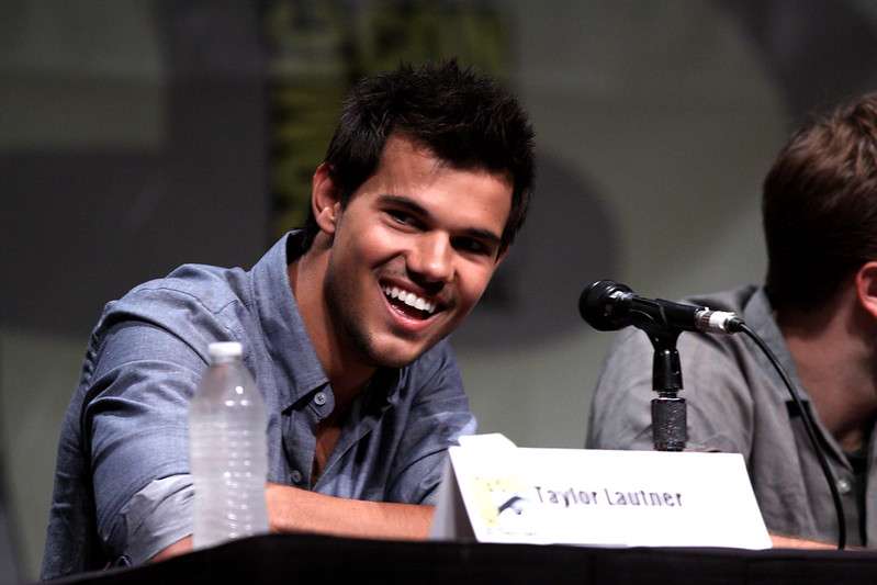 Taylor Lautner enjoying himself with his girlfriend Dome while some people think Taylor Lautner is gay.